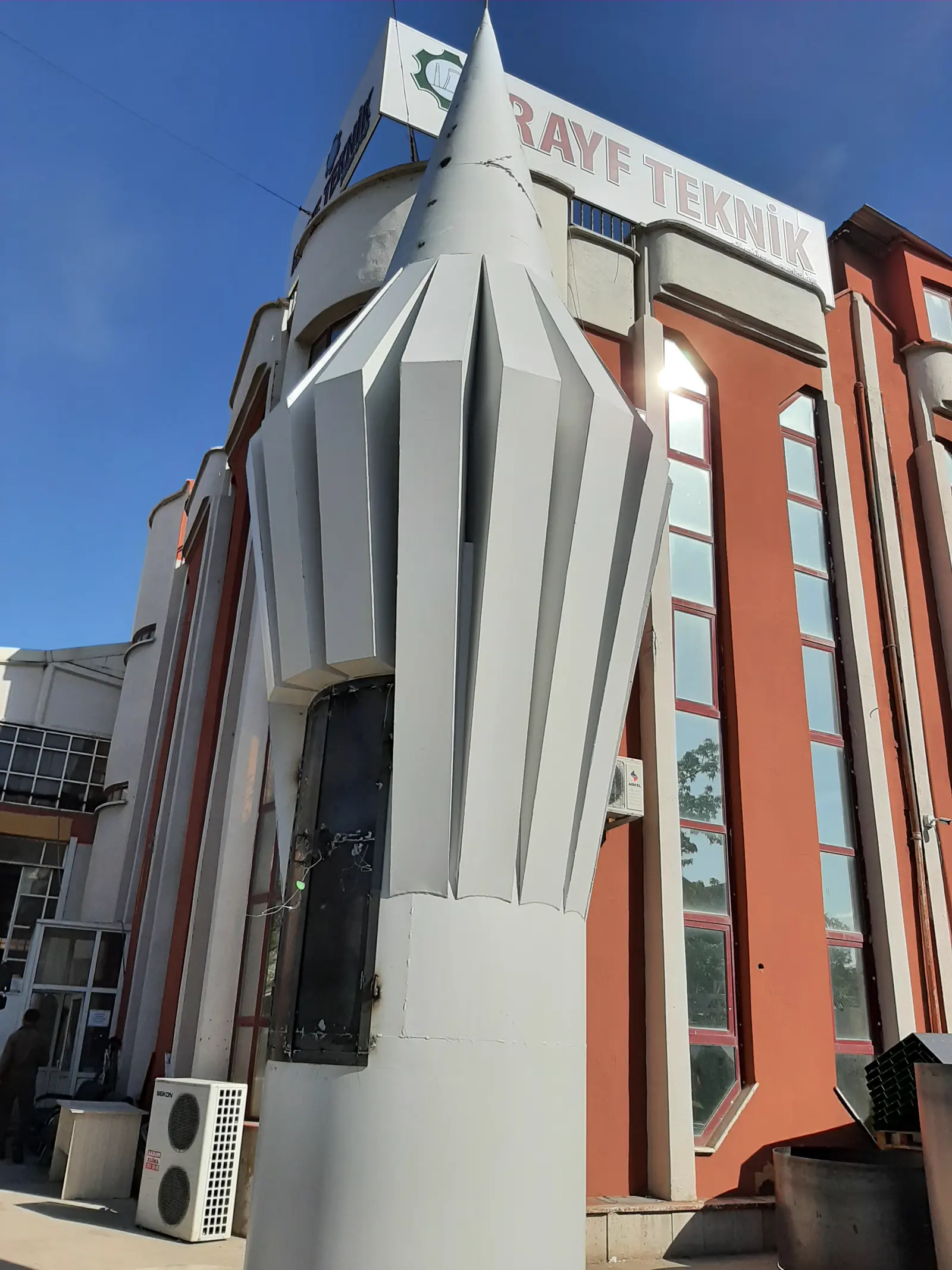 Steel minaret balcony being lifted into place by mobile crane