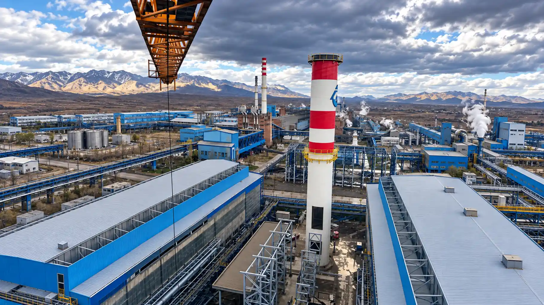 Refurbished chimney at the Eti Alüminyum plant in Seydişehir with mountains beyond